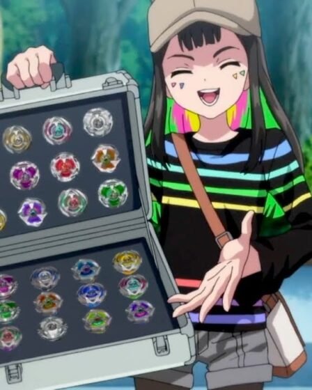 Screenshot from Beyblade X that features a girl wearing a hat and a striped shirt smiling as she holds an open case of Beyblade tops